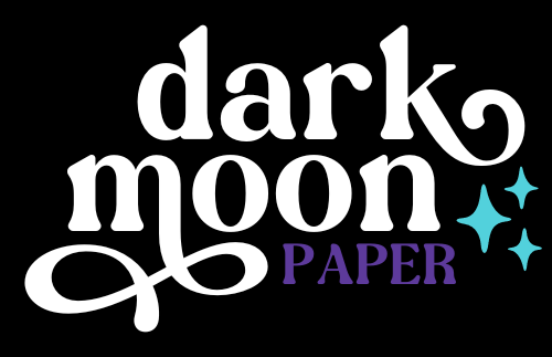 Stylized logo for Dark Moon Paper featuring starbursts and swirling type